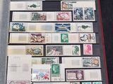 a display of stamps on display in a glass case