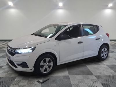 the white car is parked on a checkered floor in the garage