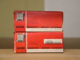 two boxes of jouet cigarettes sitting on top of a wooden table