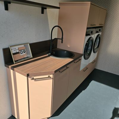 a small kitchen with a washer and dryer in it