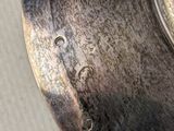 a close up of a metal object with a hole in it