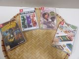 several video games are on a bamboo tray on a table