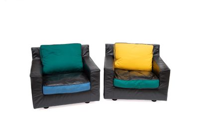 pair of black leather chairs with colorful cushions against a white background