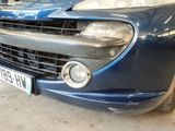 a picture of a blue car parked in a garage
