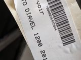 a person holding a piece of paper with a barcode on it