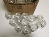 a box full of empty glass jars sitting on a table