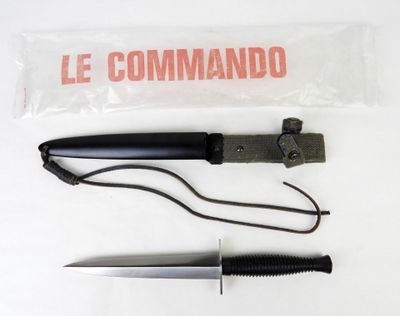 a knife that is laying on the table next to a knife