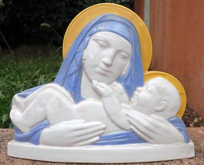 a statue of a woman holding a baby in her arms
