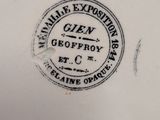 a close up of a plate with a stamp on it