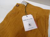 an image of a label on a pair of yellow pants