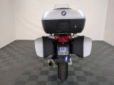 a motorcycle that is parked in a room with a checkered floor