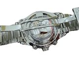 a close up of a watch on a white background