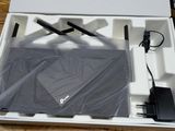 a box with a laptop and other electronics inside of it