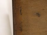 close up of a wooden drawer with a drawer pull open
