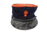 a blue hat with an orange flower on it