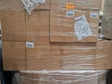 a large stack of boxes sitting on a pallet in a warehouse
