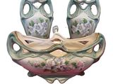 two vases that are sitting on top of each other