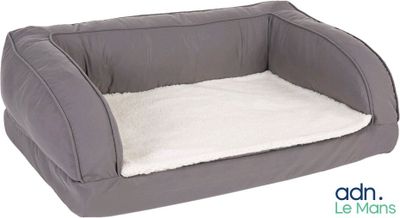 the dog bed is made of a soft fabric and has a white flee