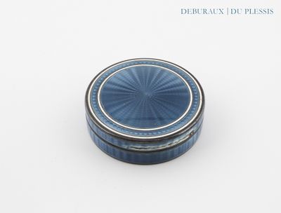 a small blue box with a lid sitting on a table