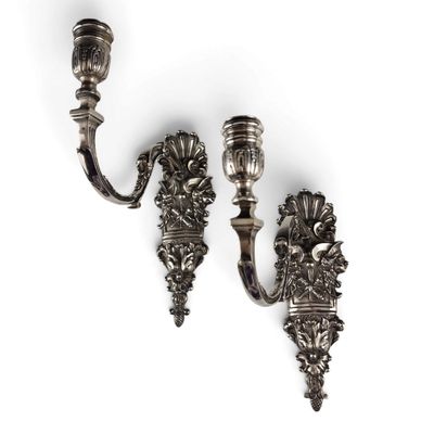 a pair of antique silver plated wall sconces on a white background