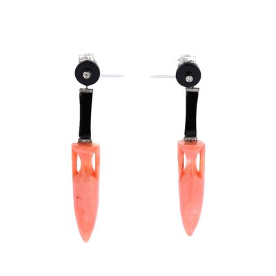 pair of orange and black earrings on a white background