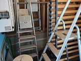 a set of stairs and a stool in a room