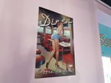 a poster of a pinup girl on the wall of a diner