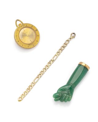 a gold watch and a green glove on a chain