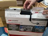 a man that is opening a box with a phone in it