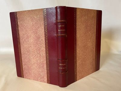 an old book with a brown cover and a brown binding