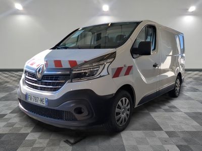 the white van is parked in a large room with checkered floor
