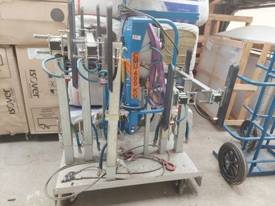 a machine that is sitting on a cart in a warehouse