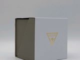 a small white box with a yellow triangle on it