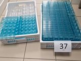 two plastic containers that are sitting on the floor