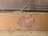 a piece of wood that has a sign on it