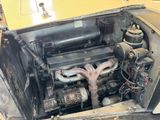 a very old engine in the back of a car
