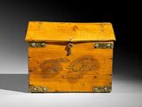 a small wooden box that has a chain on it