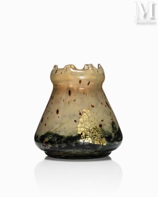 a small glass vase with a gold leaf design on it