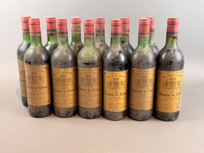 six bottles of wine are lined up in a row on a table