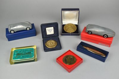 a lot of small toy cars and other items on the table