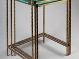 a close up of a glass table with a metal frame