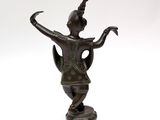 an image of a bronze statue of a woman with a bird on her head