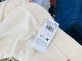 a pile of clothes with a price tag on it