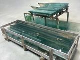 a glass table with a glass top and a metal base