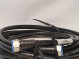 a close up of a black cable connected to a white wall