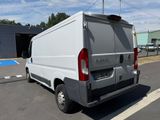 a white van that is parked in the parking lot