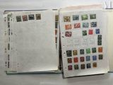 a book with stamps on it sitting on a table