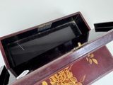 a wooden box with a floral design on it