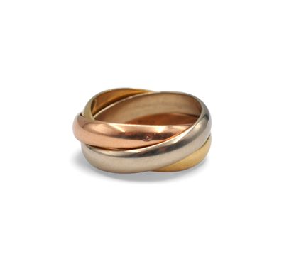 a close up of a gold and silver ring on a white background