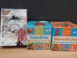 three boxes of toys on a table with a blackboard in the background
